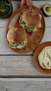 Vertical food video Cemita with quesillo cheese