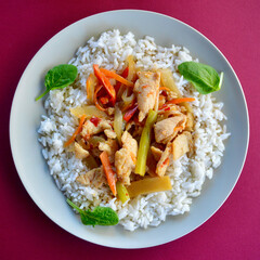 Chicken Szechuan with long grain steamed rice and baby spinach leaves.
