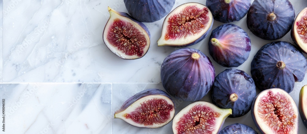 Poster flat lay of fresh ripe purple figs on a white tiled table with space for text in the image. with cop