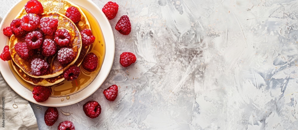Poster delicious homemade pancakes topped with fresh raspberries and drizzled with honey in a copy space im