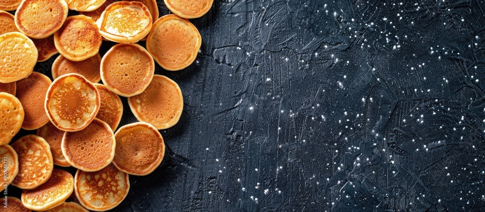 Poster Top view background of mini pancakes a menu concept for sweet breakfast or dessert with space for text showcasing a healthy organic snack serving size. with copy space image