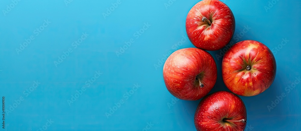 Poster vivid and fresh apples set against a blue backdrop for a healthy food concept suitable for advertisi