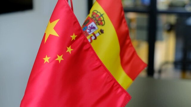 A short 9.5-second high-definition (1920x1080) video at 50 frames per second, showcasing the flags of China and Spain displayed in an office setting.