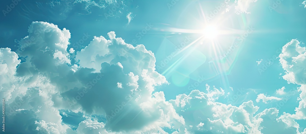 Leinwandbilder Abstract background showing a sunny blue sky with fluffy white clouds and light flare ideal for adding content on copy space image