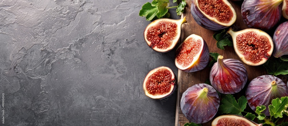 Poster An abundance of figs on a cutting board with some sliced all displayed in a copy space image