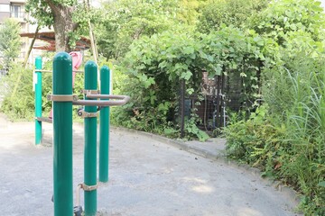 July 28, 2024, Shinjuku Ward, Tokyo, Japan, Drainage facilities in a park entangled with ivy.