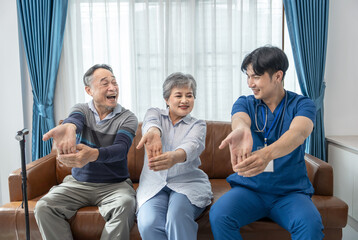 a young male assistant in uniform advice and help asian senior couple arm stretch exercise in the...