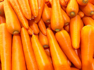 Close up detail fresh and sweet bunch pile of carrot natural background