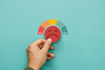 Service rating, satisfaction and negative feedback. A man choose bad face emoticon give a one star...