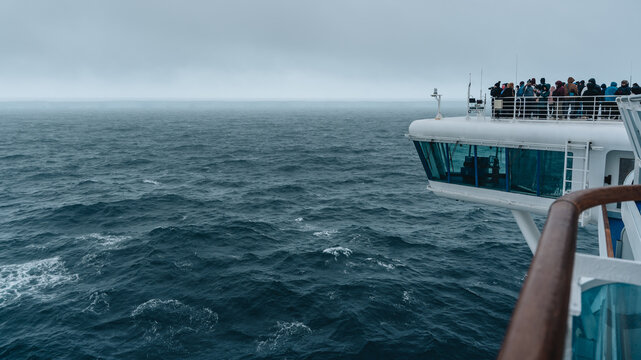 Antarctica - December 26th 2023 - Photo of A23a Iceberg from Cruise Ship. Dozens of Passengers View Photograph Huge Floating Ice Rough Seas