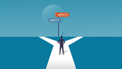 A businessman in doubt, having to choose between two different choices indicated by path pointing in opposite direction