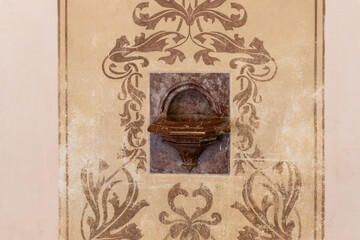 Decorative washbasin at the entrance to Saints Peter and Paul Basilica in Vysehrad district of Prague in Czech Republic