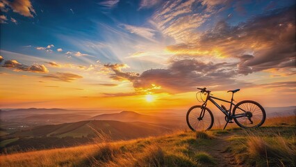 Fototapeta premium Beautiful sunset view with a mountain bike at the top of a hill , sunset, view, mountain bike, hill, outdoors