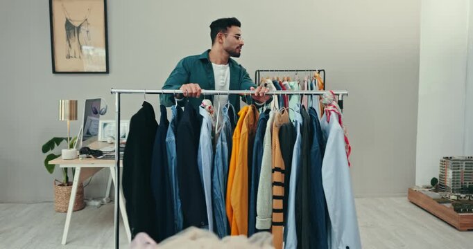 Small business, startup and man with fashion rail in boutique for clothes, display or stock setup. Supply chain, startup and male retail store owner at mall with outfit selection, wardrobe or storage