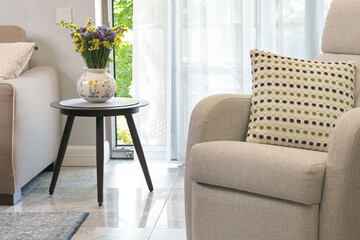 Sliding door in living room with exit to terrace. Modern furniture in Scandinavian style. Interior and design. 