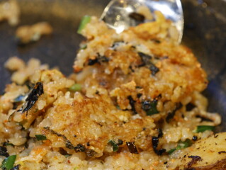 Korean fried rice after barbeque on the grill. Crispy bokkeumbob, crunchy rice with vegetables.