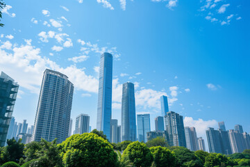 Fototapeta premium Skyscrapers Viewed from Below with Blue Sky and White Clouds