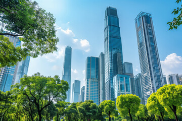 Fototapeta premium Skyscrapers Reaching into a Bright Blue Sky with White Clouds on a Sunny Day