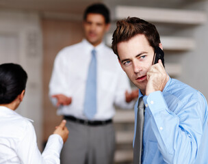 Business, man and phone call for meeting in office with communication, networking and chat as finance consultant. Professional, male person and mobile for discussion, feedback and startup negotiation