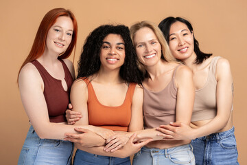 Diverse group of women embracing each other in support and solidarity