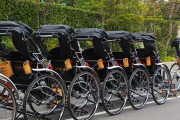 Many rickshaws from the back in a row in Kyoto Japan