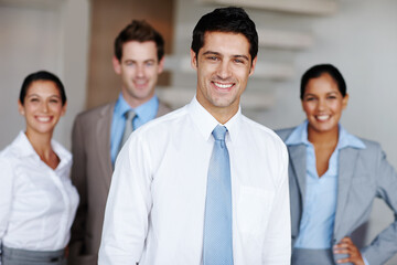 Businessman, portrait and smile with team in office for professional, leadership and confidence at work. Happy, attorney and diversity with law employees for legal internship, support and mentorship
