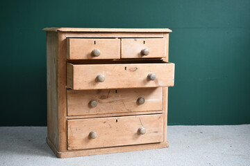 Antique chest of drawers with drawer open