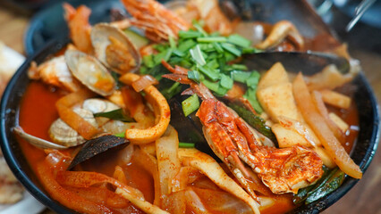 Food made with a lot of seafood such as squid and crab
