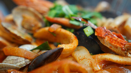 Food made with a lot of seafood such as squid and crab