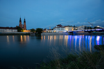 Fototapeta premium Panorama of the city by the river in the evening