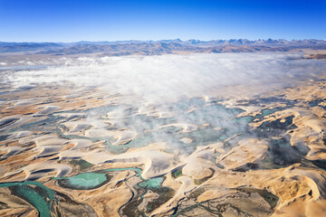 he sand dune of Zhongba, Tibet with the  Yarlung Zangbo/Yarlung Tsangpo River, morning fog and Himalaya
