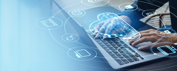 Man typing on laptop, cloud service hologram and devices connection hud