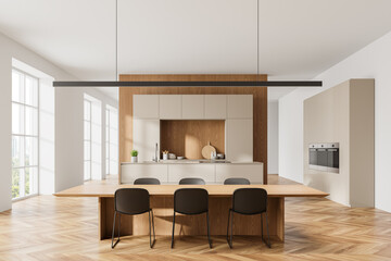 Cozy home kitchen interior with dining table andh chairs, cabinet and window