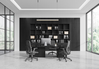 Modern office interior with black furniture and large windows. 3D Rendering
