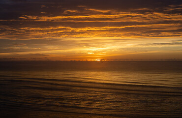Beautiful Sunrise at Beach and Sea with Golden Sky