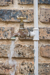 Water running from an open tap