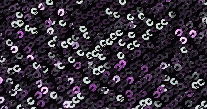 Purple sequins fabric background, texture.
