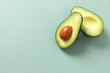 Green avocado on a color background 