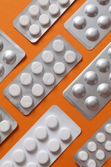 Pills in blisters on a colored background