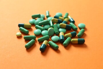 Different pills on a color background