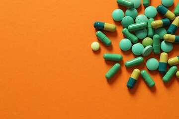 Different pills on a color background