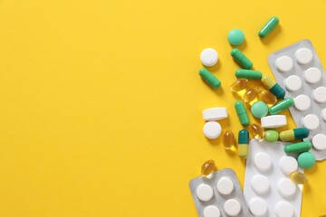 Different pills on a color background