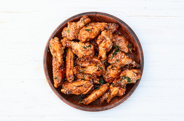 Caramelized in sause chicken wings  . Bar-b-q food background photo