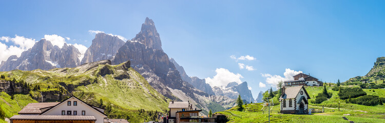Panoramic view at the mountains from Rolle pass in Dolomites, Italy
