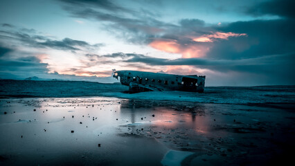 Aerial drone view of crashed plane on frozen Solheimasandur beach in winter, Iceland