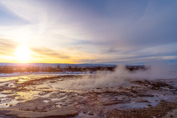 Moments before the eruption of the Strokkur Geyser at sunrise. Frozen winter in Iceland