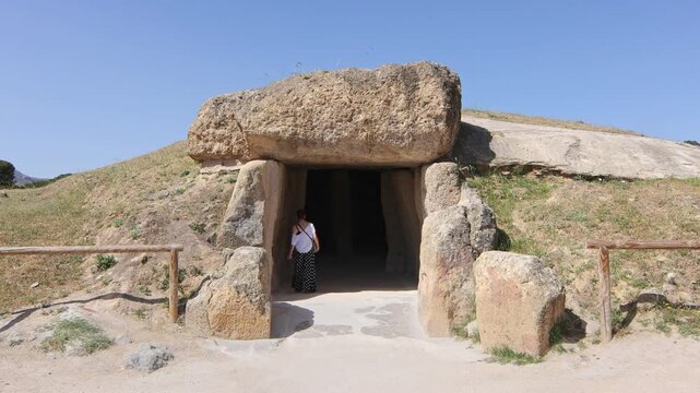 Caucasian mature woman visiting the dolmen of Antequera, Malaga, Spain.