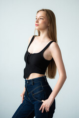 Woman wearing casual clothes poses on white background. Model agency snapshot