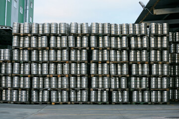 Metal barrels full of beer stacked in the yard of beer plant Obolon to deliver for sale.