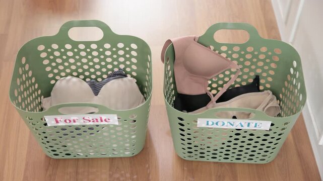 Young adult woman asia people arrange stack undies sale manage used old bra bank neat basket box clean house closet eco care. Happy asian smile go green wife home chores net zero waste fabric issue.
